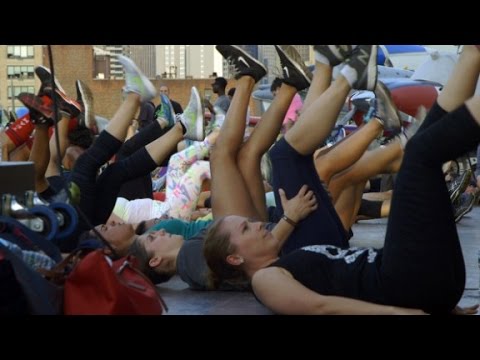 hundreds do burpees on the uss intrepid