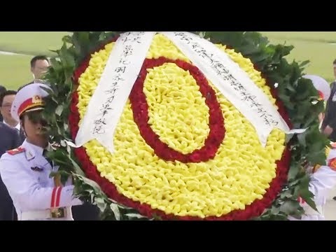 xi lays wreath at the ho chi minh mausoleum