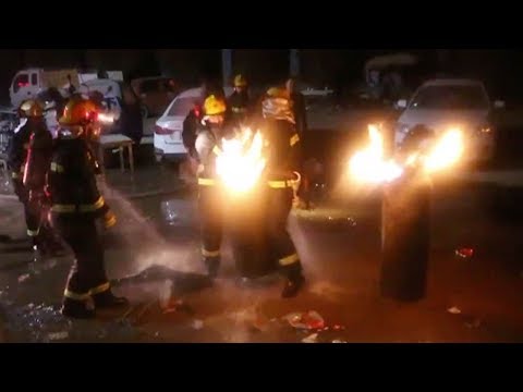 firemen risk lives to put out blazing gas tanks