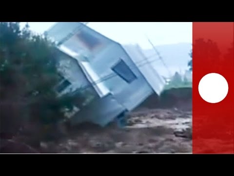 rushing flood water sweeps house away chile