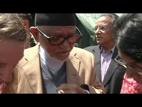 nepalese pm visits quake zone and takes woman