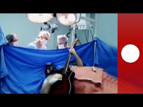 brain surgery patient plays guitar concert during operation